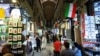 Shoppers walk through Tehran’s Grand Bazaar on April 13.