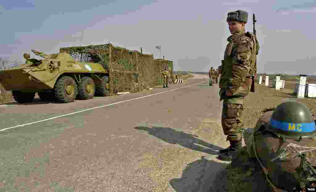 Russian peacekeepers guard a checkpoint in Moldova&#39;s breakaway Transdniester region in January 2012. A force comprising troops from Moldova, Russia, and the breakaway region of Transdniester was set up following a truce in 1992 to stop fighting between Moldovan forces and Transdniestrian forces backed by Cossacks and Russian troops stationed in the enclave. The peace has held since then, but Transdniester&#39;s independence is not recognized by any country. Russia has refused repeated demands by the Moldovan government to facilitate the replacement of Russian troops with internationally recognized peacekeepers and maintains strong influence in Moldova as a whole.