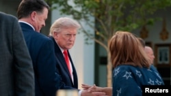 US President Donald Trump hosts US farmers in the Rose Garden at the White House on June 25.