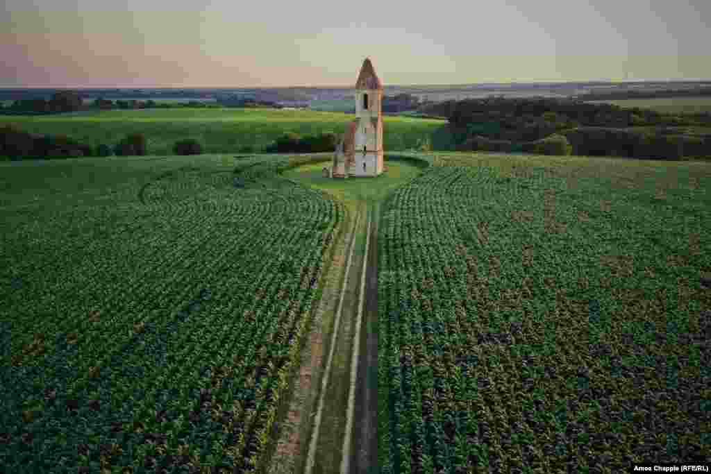 Cornfields surround the ancient Somogyvamos steppe church, near Lake Balaton. The lonely ruins are the only remains of a village that was reportedly wiped out by Ottoman Turks during a war that raged in the region in the Middle Ages. &nbsp;