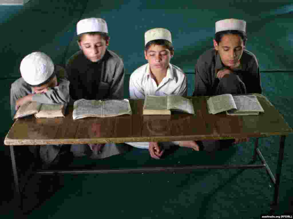 Children at school. Photo by RFE/RL's Radio Free Afghanistan - The literacy rate for boys in Afghanistan is only 49 percent; for Afghan girls, it's 18 percent.