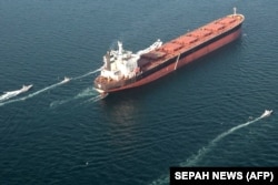Small boats seen near a vessel during an Iranian naval exercise in February.