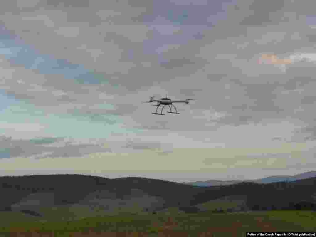 A drone inspects the blast site. Two months after the first explosion, another 13 tons of ammunition detonated at the same site.