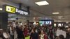 Demonstrators protest President Donald Trump's travel ban at Dulles airport on January 30.