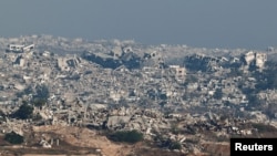 O imagine generală a clădirilor avariate și a ruinelor din nordul Gazei, văzută din partea israeliană a frontierei dintre Israel și Gaza, 7 iulie 2025.