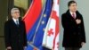 Georgia -- President Mikheil Saakashvili (R) and his visiting Armenian counterpart Serzh Sarkisian attend an official welcome ceremony in Tbilisi, 29Nov2011