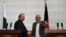 Pakistani Prime Minister Nawaz Sharif (L) shaking hands with Afghan President Ashraf Ghani in Kabul on May 12.