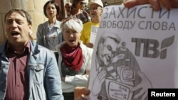 Ukrainian journalists and TVi supporters protest against media censorship in front of the National Television and Radio Broadcasting Council in Kyiv on September 12.