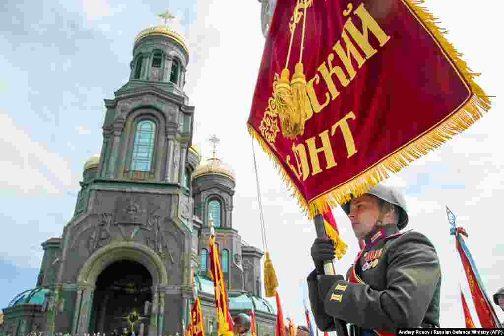 Russian servicemen attend the opening ceremony of the cathedral on June 14.