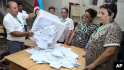 Ballots being counted after Azerbaijan's parliamentary elections on September 1. 