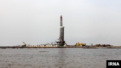 Oil production installation in Khuzestan, Iran surrounded by flood waters. April 2019