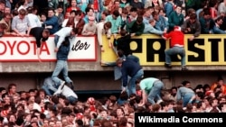 Liverpool fans trying to escape severe overcrowding during the severe crushing at Hillsborough stadium in Sheffield England during an FA Cup semi-final football match between Liverpool and Nottingham Forest. 1989