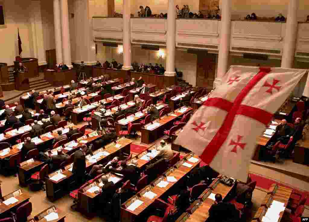 The new Georgian flag flies in parliament during its session in Tbilisi on January 14, 2004. Georgia adopted a new national flag shortly after Saakashvili was elected president.