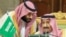 FILE: Saudi Arabia's Crown Prince Mohammed bin Salman talks with Saudi Arabia's King Salman bin Abdulaziz Al Saud during the Gulf Cooperation Council's (GCC) Summit in Riyadh in December 2018.