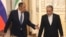 Russian Foreign Minister Sergei Lavrov and Iranian Foreign Minister Abbas Araghchi arrive for a press conference after meeting in Tehran on October 19.