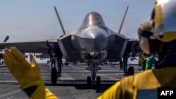 An F-35C Lightning II prepares to launch from the deck of the USS Abraham Lincoln aircraft carrier in the Arabian Sea on February 15.