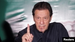 Imran Khan gestures as he speaks to the media at his residence in Lahore. (file photo)