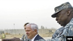 Lieutenant General Lloyd Austin (right) welcomes U.S. Defense Secretary Robert Gates to Baghdad earlier this month.