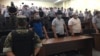 The courtroom listens as the judge delivers the verdicts in Shymkent on July 26.