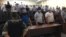 The courtroom listens as the judge delivers the verdicts in Shymkent on July 26.
