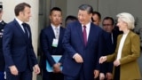 French President Emmanuel Macron (left), Chinese leader Xi Jinping (center), and European Commission President Ursula von der Leyen (right) leave after holding a trilateral talks in Paris in 2024. 