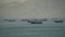 Vessels are stranded near the Strait of Hormuz amid reports of a tentative deal to extend the cease-fire and allow traffic to flow through the waterway.