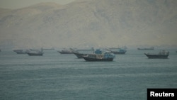 Vessels lie anchored at the Strait of Hormuz on May 25.