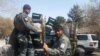 Afghan policemen arrive at the site of a blast in Kabul on March 21.