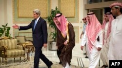 U.S. Secretary of State John Kerry (left) is welcomed by Saudi officials upon his arrival in Riyadh on November 3.