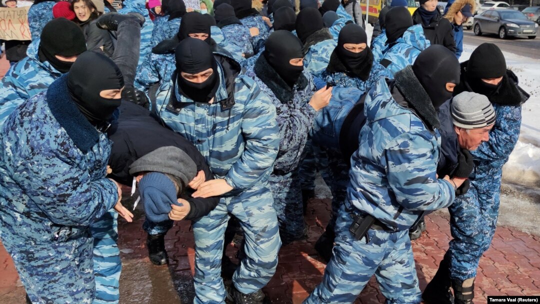 Kazakh police officers detain protesters during an opposition rally in Nur-Sultan earlier this year. 