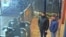 Both suspects, Aleksandr Petrov (right) and Ruslan Boshirov, stand at Salisbury train station on March 3, 2018.
