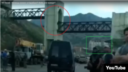 RFE/RL identified a derelict pedestrian bridge shown in the clip, as well as other landmarks, as being located near the Crimean resort town of Morske.