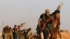 Fighters from the Free Syrian Army battle against the Islamic State (IS) group north of the embattled city of Aleppo on October 10, 2016