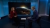 Former US Space Force commander DeAnna Burt talking to RFE/RL's Ray Furlong