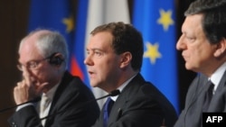 Russia's Dmitry Medvedev is flanked at the EU-Russia summit by Commission President Jose Manuel Barroso (right) and EU President Herman Van Rompuy.