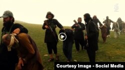 Grab from a video that shows militants loyal to the Islamic State (IS) blowing up bound and blindfolded Afghan prisoners with explosives. The victims were from Achin district in Nangarhar province.