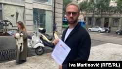 Belarusian activist Andrey Hnyot (also known as Andrew Gnyot) submits the appeal of public figures for his release to the Serbian presidency in Belgrade on September 16.