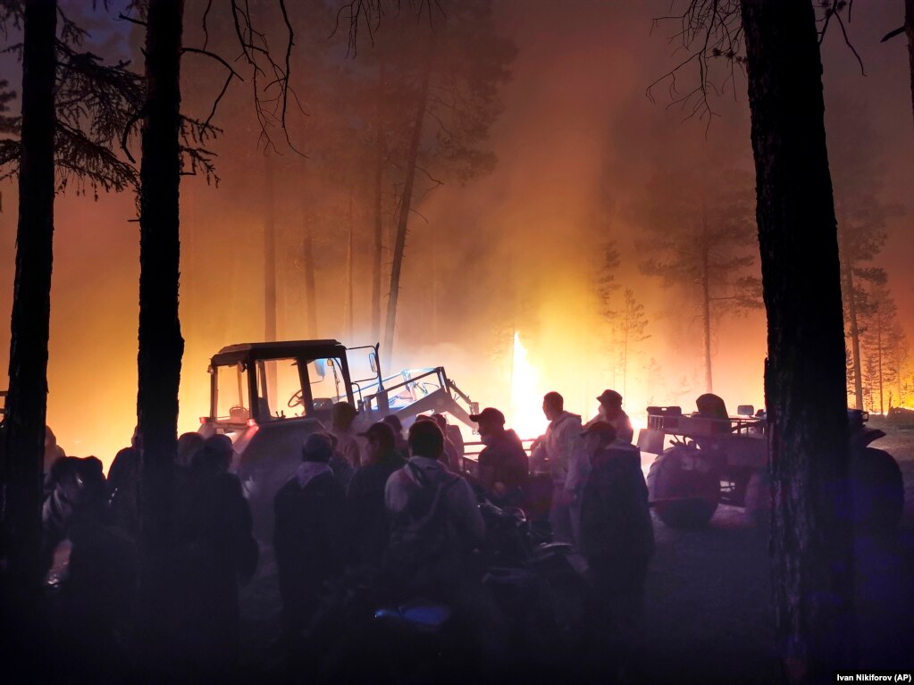 Heavy earth-moving equipment was used to try and block the progress of the flames through a forest.