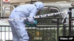 A forensics officer gathers evidence at the scene of a terror attack in central London on the evening of June 3 that killed seven people.