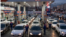 Iranians line up in their vehicles to get gas at a station in Tehran. 