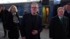 Britain's Prime Minister Keir Starmer (center) is greeted by Ukrainian officials and the U.K ambassador to Kyiv, Martin Harris (right), upon arriving via train for a visit to Kyiv on January 16. 