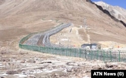The Chinese border viewed from Afghan territory around the time of the inauguration of the road to the eastern tip of Afghanistan.