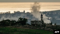 Smoke rises from a site targeted by Israeli artillery in the village of Zawtar El Charkiyeh in southern Lebanon on March 25.