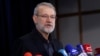Ali Larijani talks to reporters after registering his name as a candidate for the June 2024 presidential elections in Tehran, on May 31, 2024. 