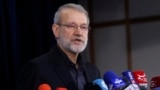 Ali Larijani talks to reporters after registering his name as a candidate for the June 2024 presidential elections in Tehran, on May 31, 2024. 