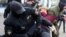 Belarus - Anti-riot police officers detain and arrest a woman demonstrating during a rally to protest against the presidential election results in Minsk, 19sep2020