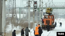 Investigators at the site of the blast on a railway line near Russia's second-largest city, St. Petersburg, on February 2..