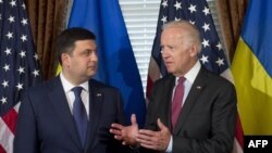 U.S. Vice President Joe Biden (right) speaks with Ukrainian Prime Minister Volodymyr Hroysman during the latter's visit to Washington this week. 