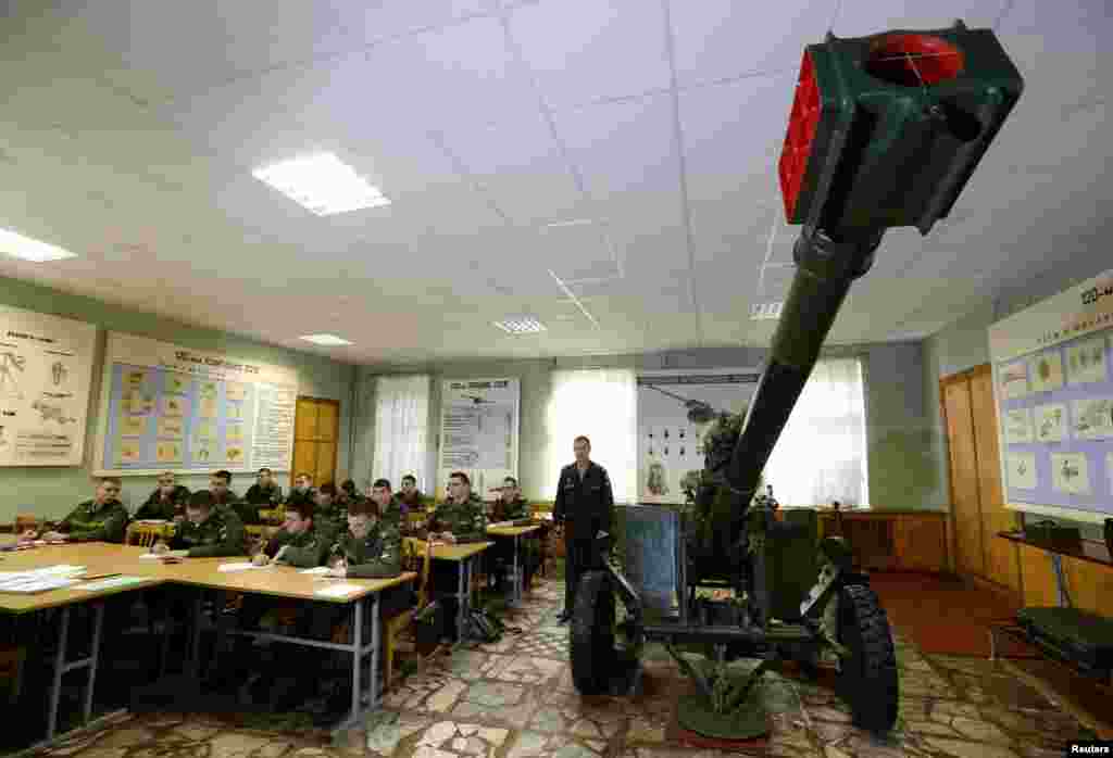 Russian students look at weapons during celebrations marking the Day of Conscript at the Mikhailovskaya Military Academy of Artillery in St. Petersburg on&nbsp;October 24. (Reuters/Aleksandr Demianchuk) 