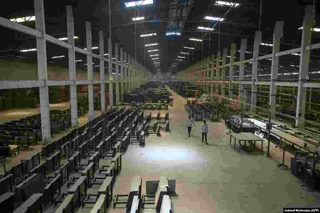 Workers in a ceramics factory in Morbi, India. The factory has been closed since early March due to Indian oil and gas tankers being unable to transit the Strait of Hormuz.Hundreds of factories in Morbi alone have reportedly halted operations due to the squeeze on fuel needed to heat the kilns of India's ceramics industry.